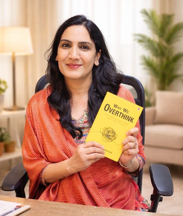 Richa Agarwal holding her book Why We Overthink